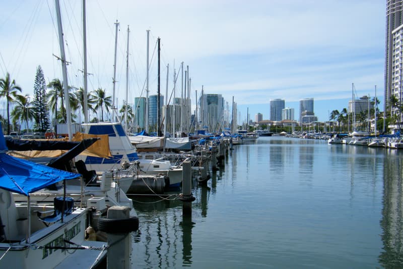 Boats in their slips on a clear day at the Ala Wai Small Boat Harbor