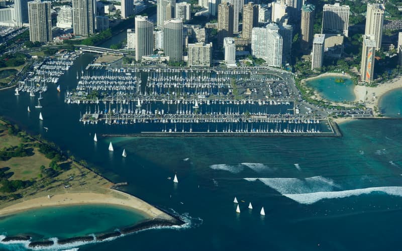 Aerial view of the Ala Wai Small Boat Harbor beside Waikīkī and Magic Island